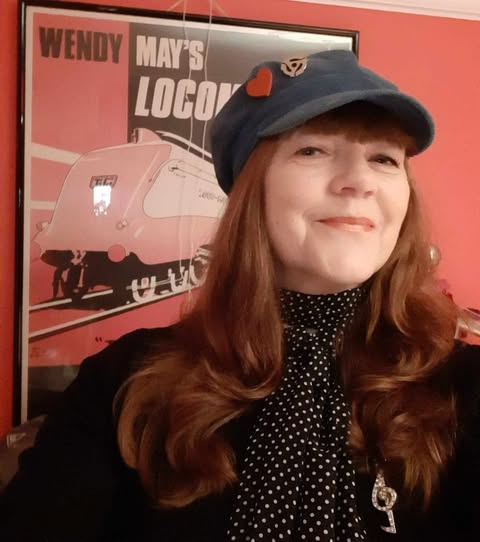 Wendy May smiling with hat on